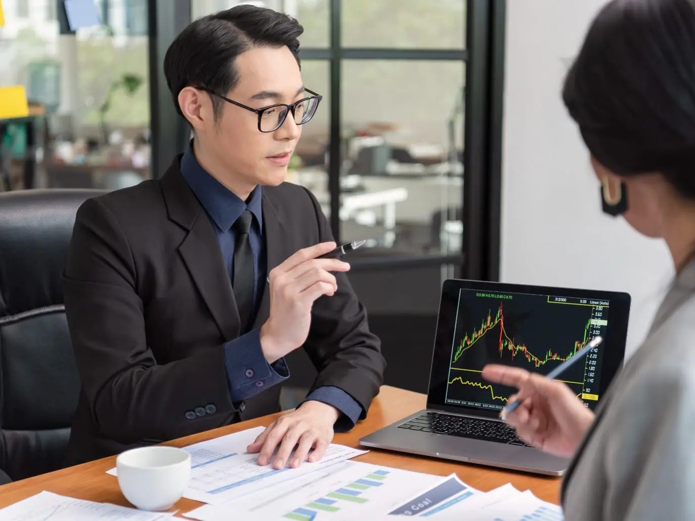 person in a meeting - Best Remote Prop Trading Firms