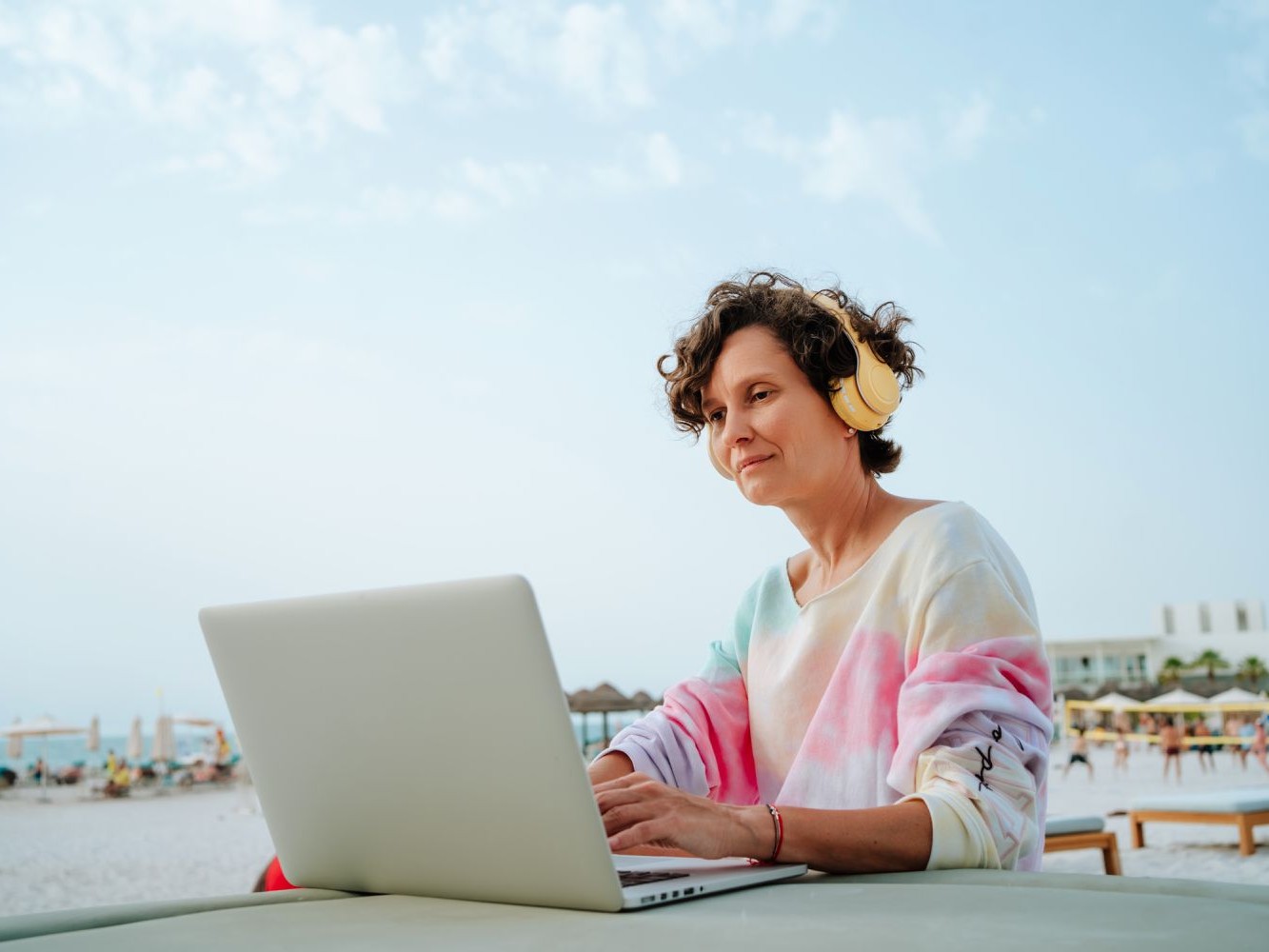 woman with headphones - What is the Consistency Rule in a Prop Firm