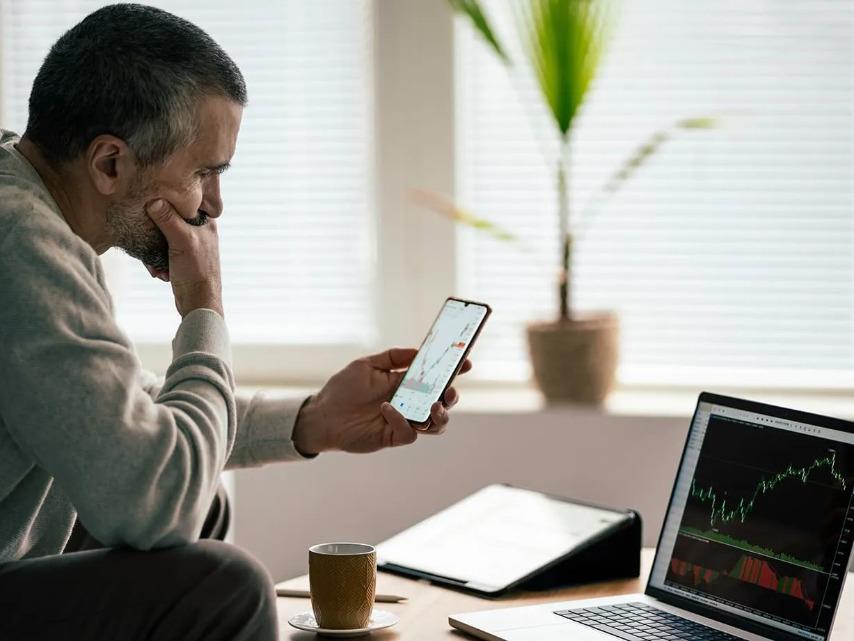 man analyzing trades - Which Forex Prop Offers the Easiest Challenge