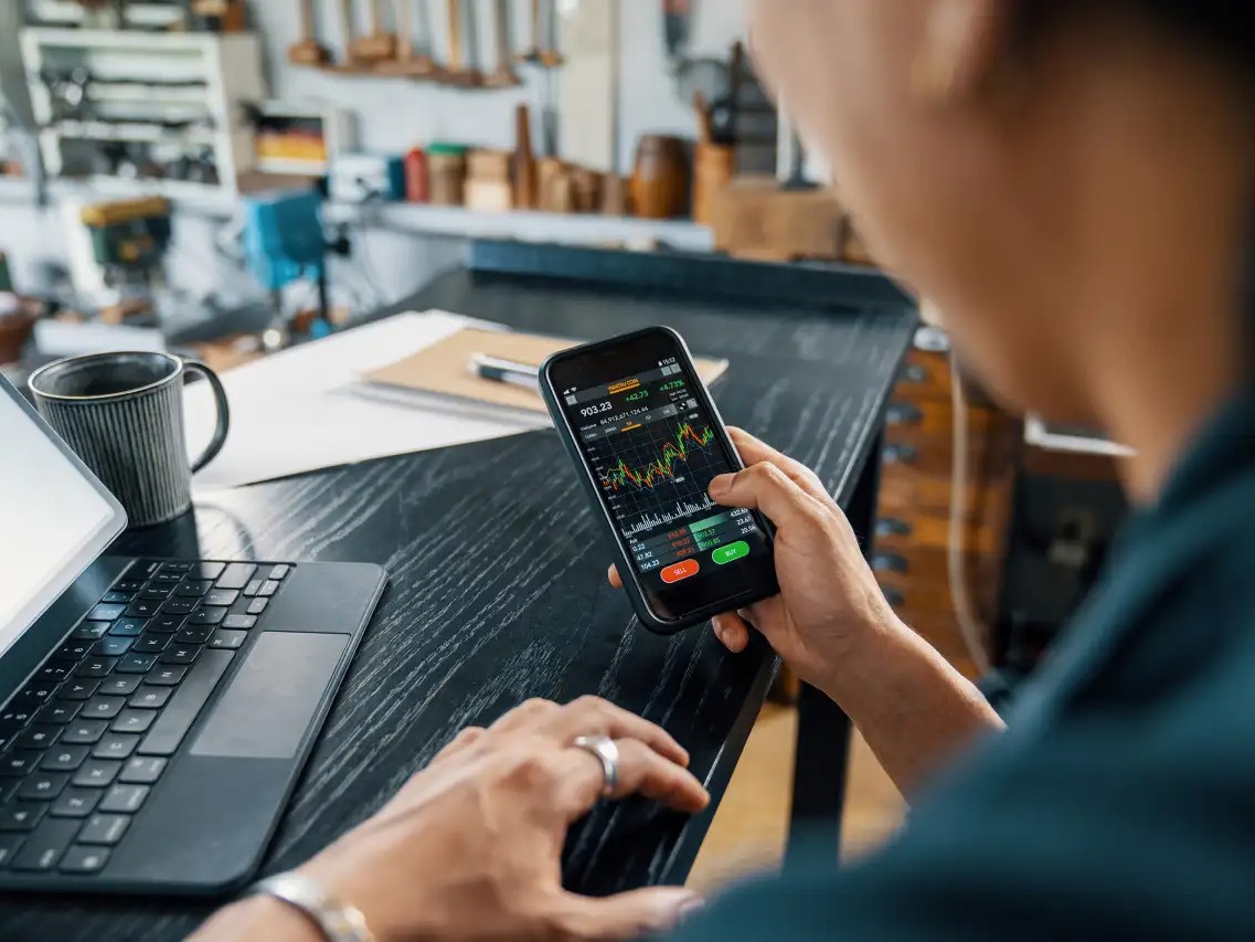 man looking at charts - How Do I Join a Prop Firm Trading Challenge?