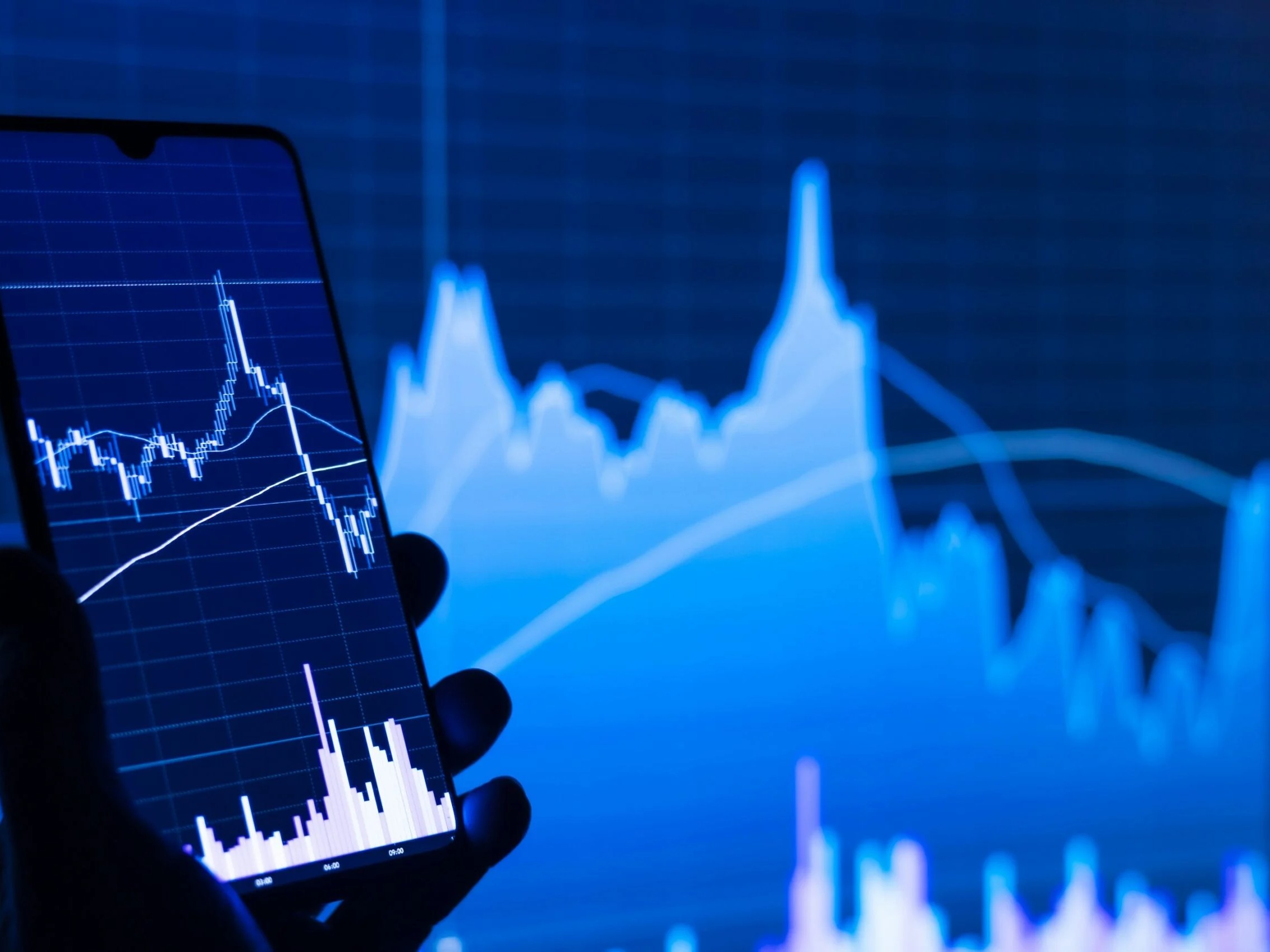 person with mobile - Best Futures Prop Trading Challenge Fees