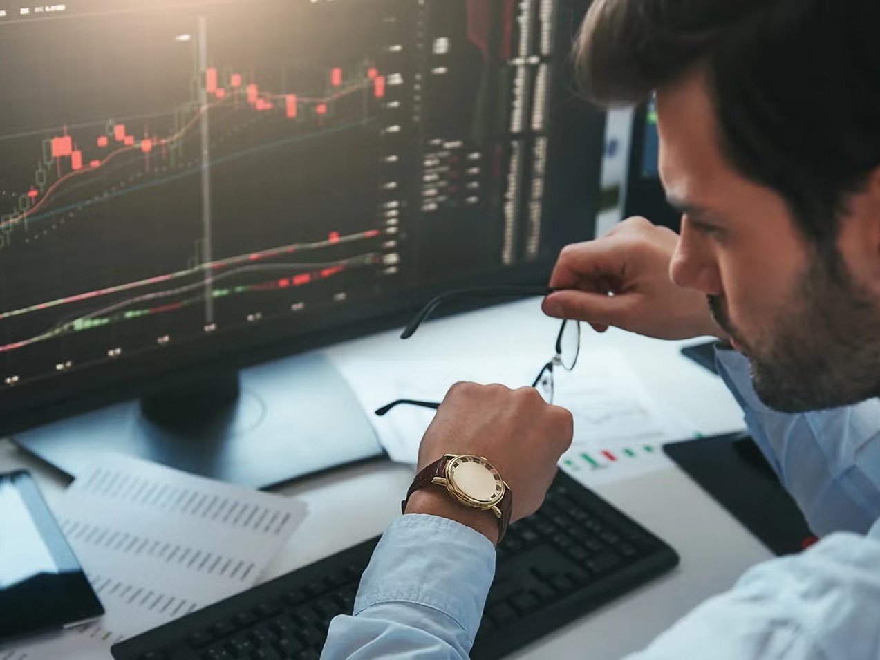 man looking at time - Cheapest Prop Firm Challenges