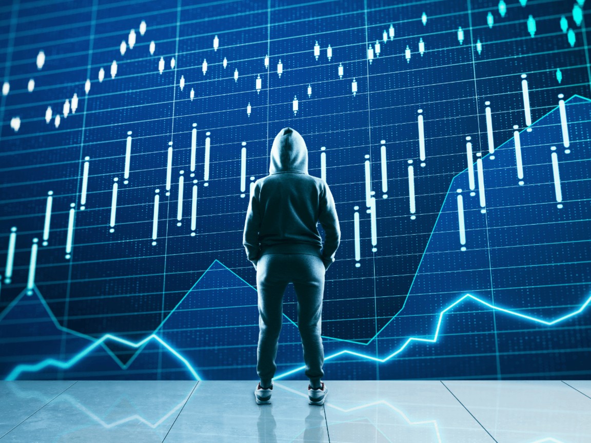 man looking at charts - Day Trading Micro Futures
