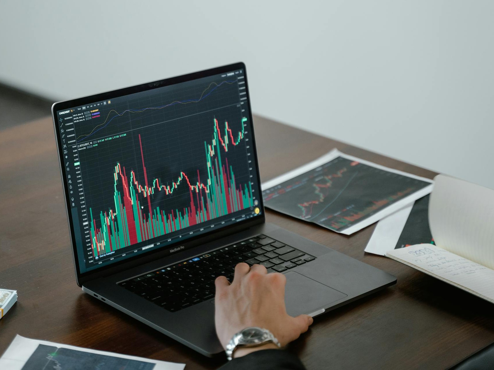 man looking at trades - AI Futures Trading