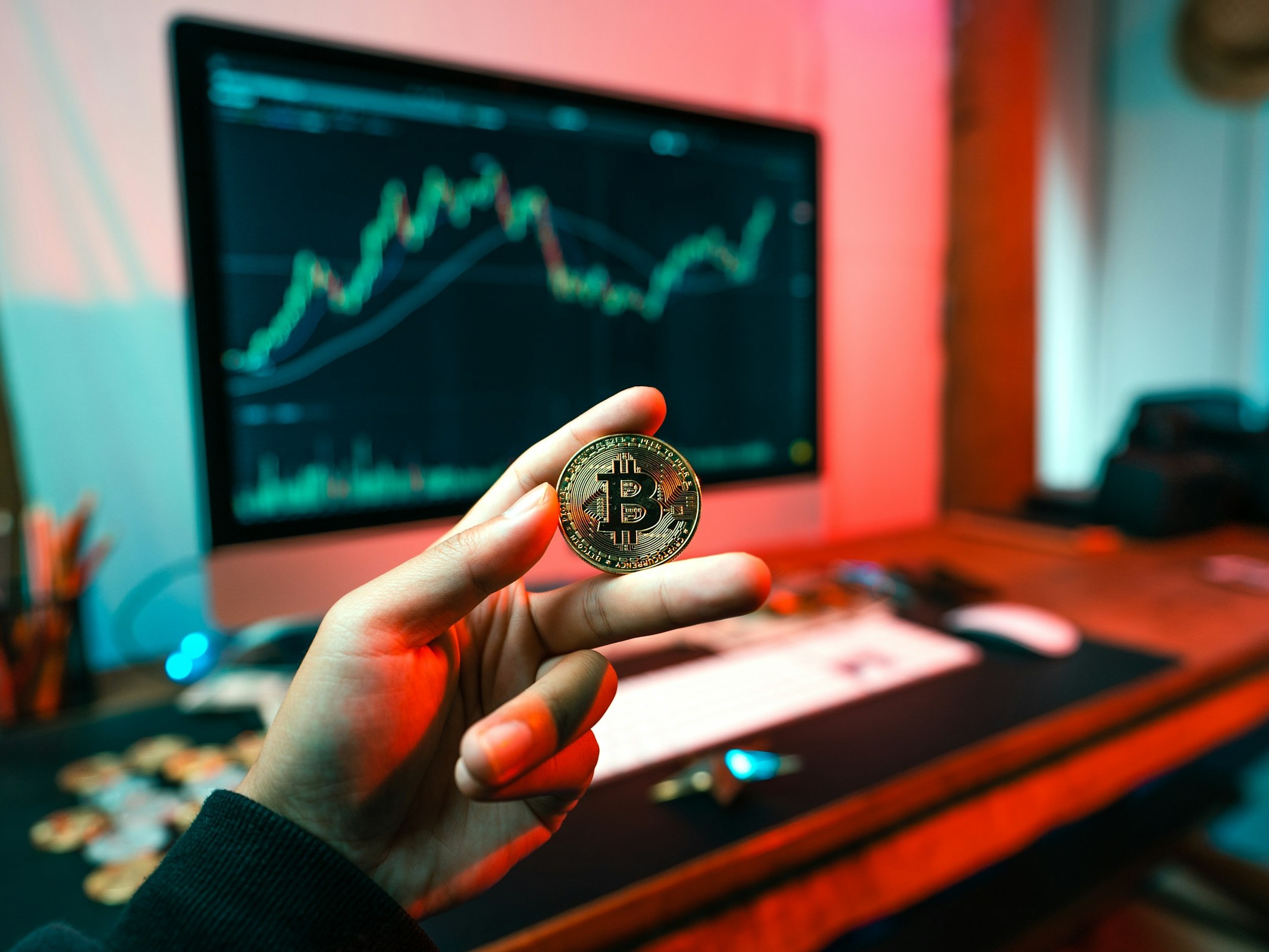 Person Holding Coin - Trading Futures vs Stocks